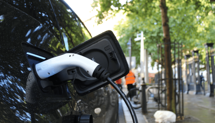 An electric vehicle plugged in for charging in Birmingham city centre.