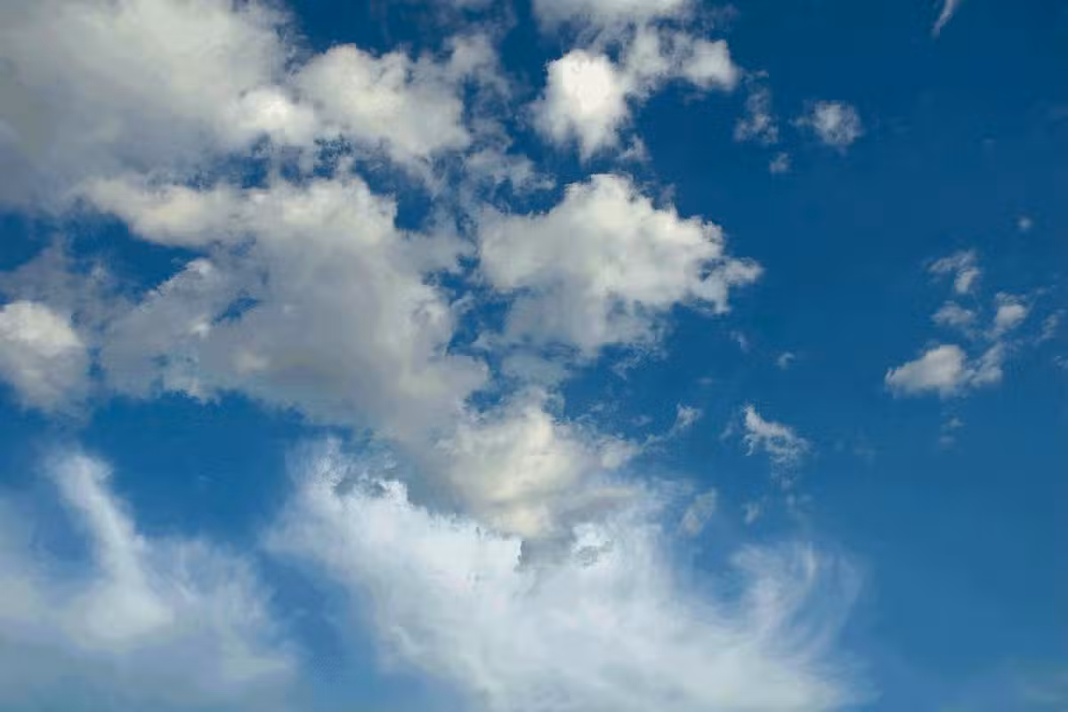 A title image of bright blue skies, filled with assorted clouds.